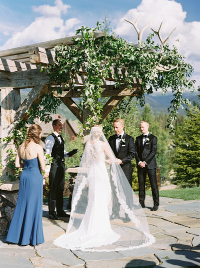 An arch is always a great idea for the backdrop of your outdoor mountain wedding.